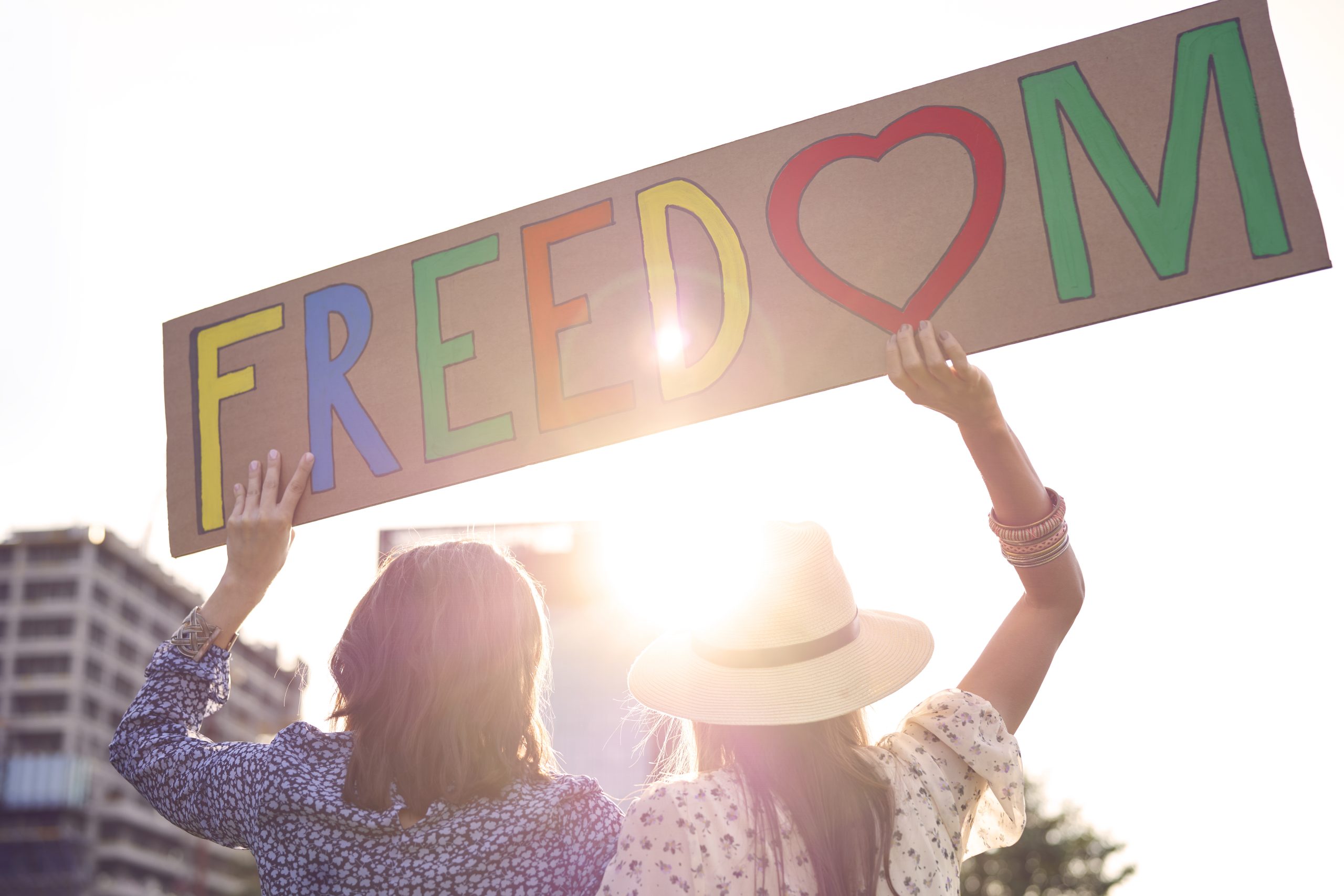 A hand raised towards the sun — the movement of self-acceptance