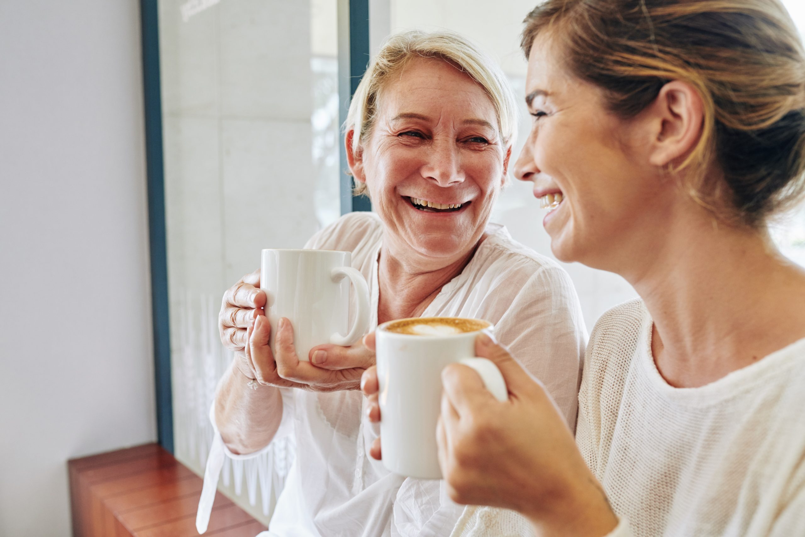 Warmth in relationship — a woman smiling against evening lights