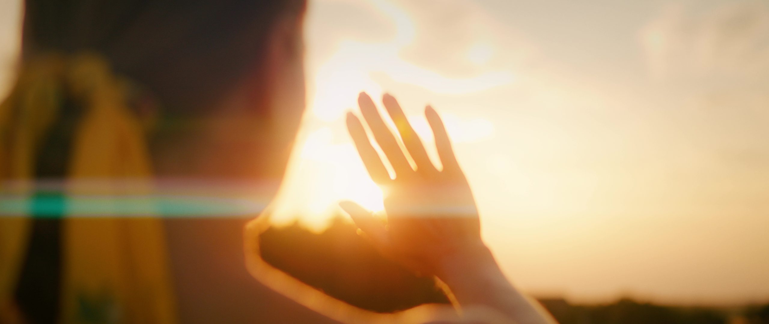 A hand reaching towards the light — the openness that begins therapy